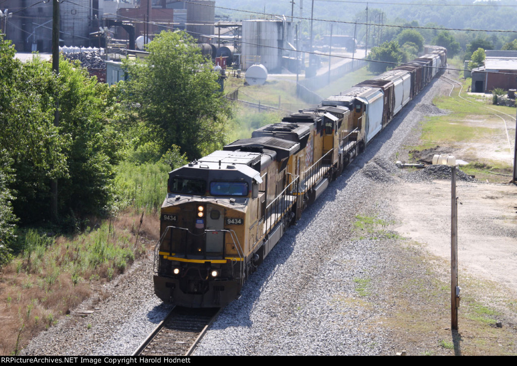UP 9434 leads two other UP units and NS train 135 westbound